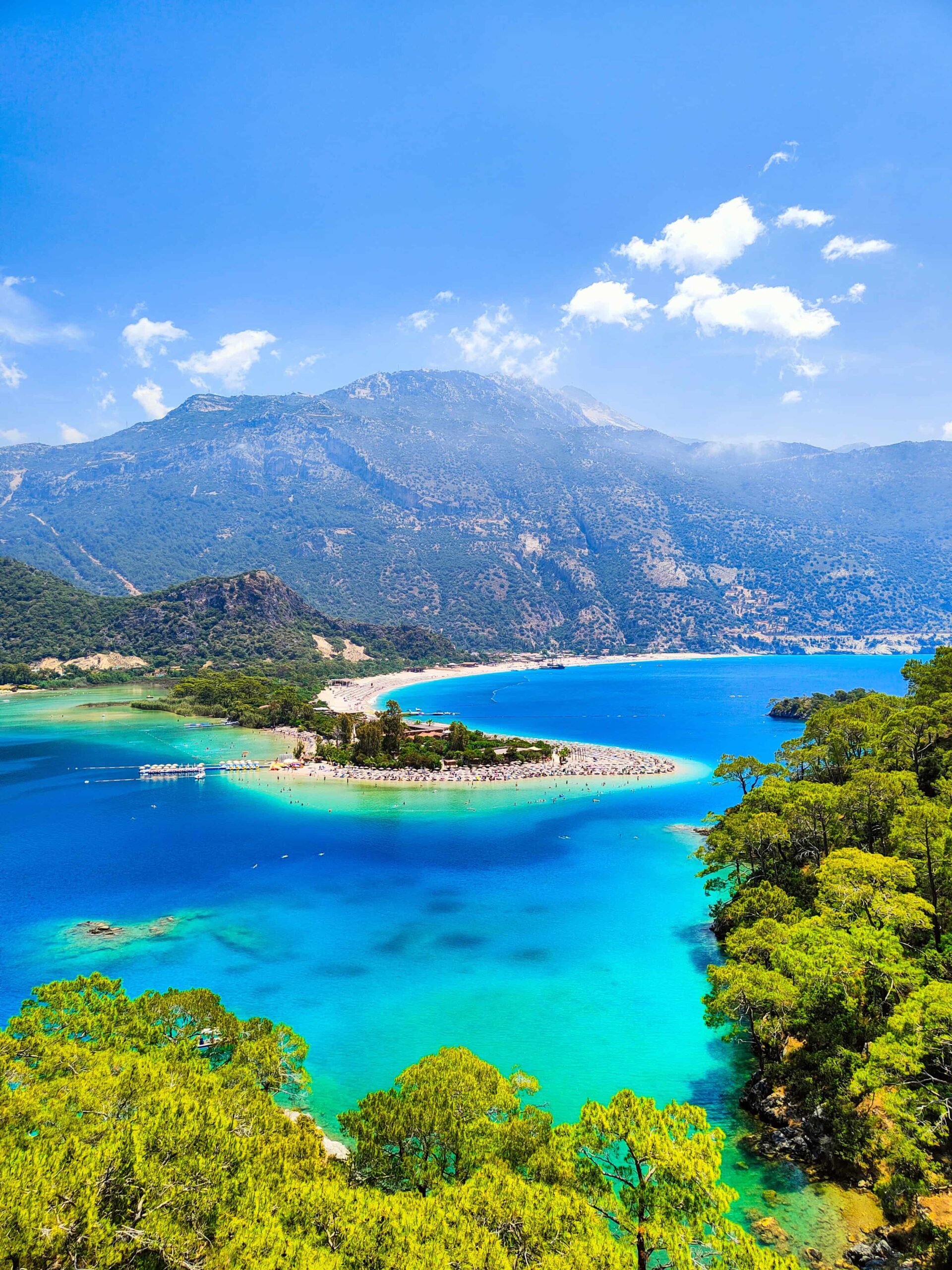 Oludeniz is a resort village on the southwest coast of Turkey with stunning blue lagoon, white sandy beaches and fun-loving paragliders.