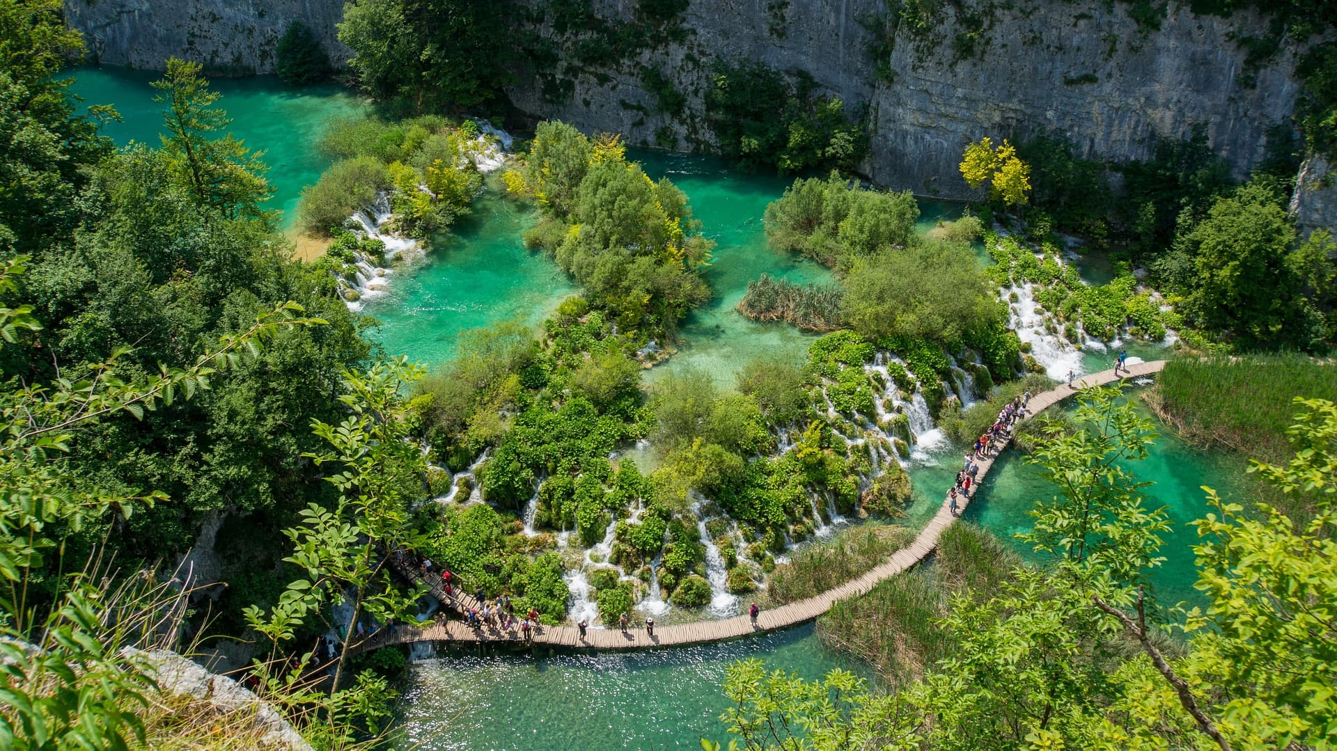 Get close to the turquoise waters of Plitvice Lakes National Park strolling along the boardwalks suspended over the parks lakes and waterfalls.